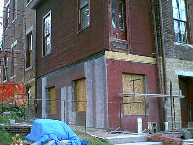 rear porch, 718, during application of new foundation facade
